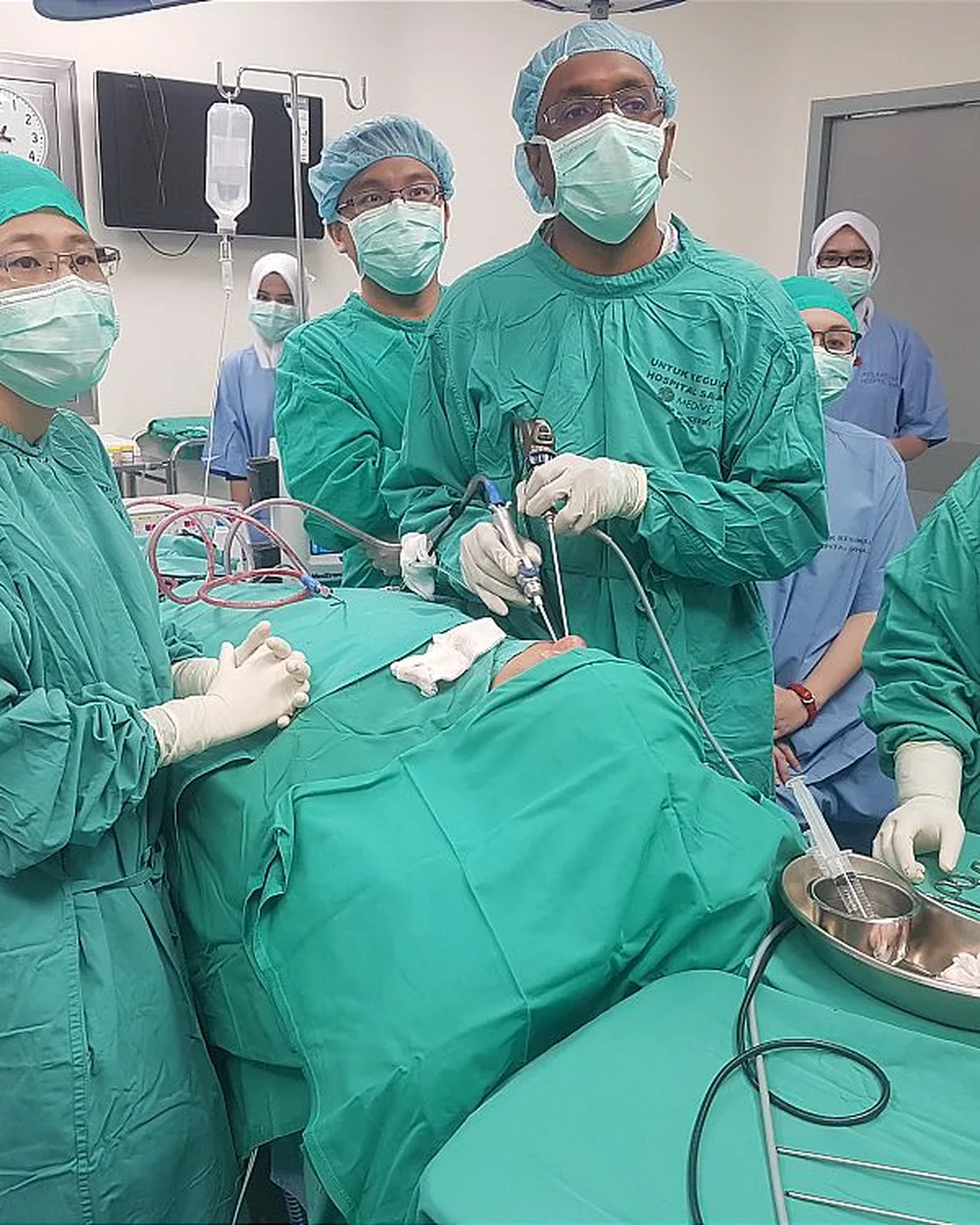 Dr Puvan and the surgical team in the operating theatre
